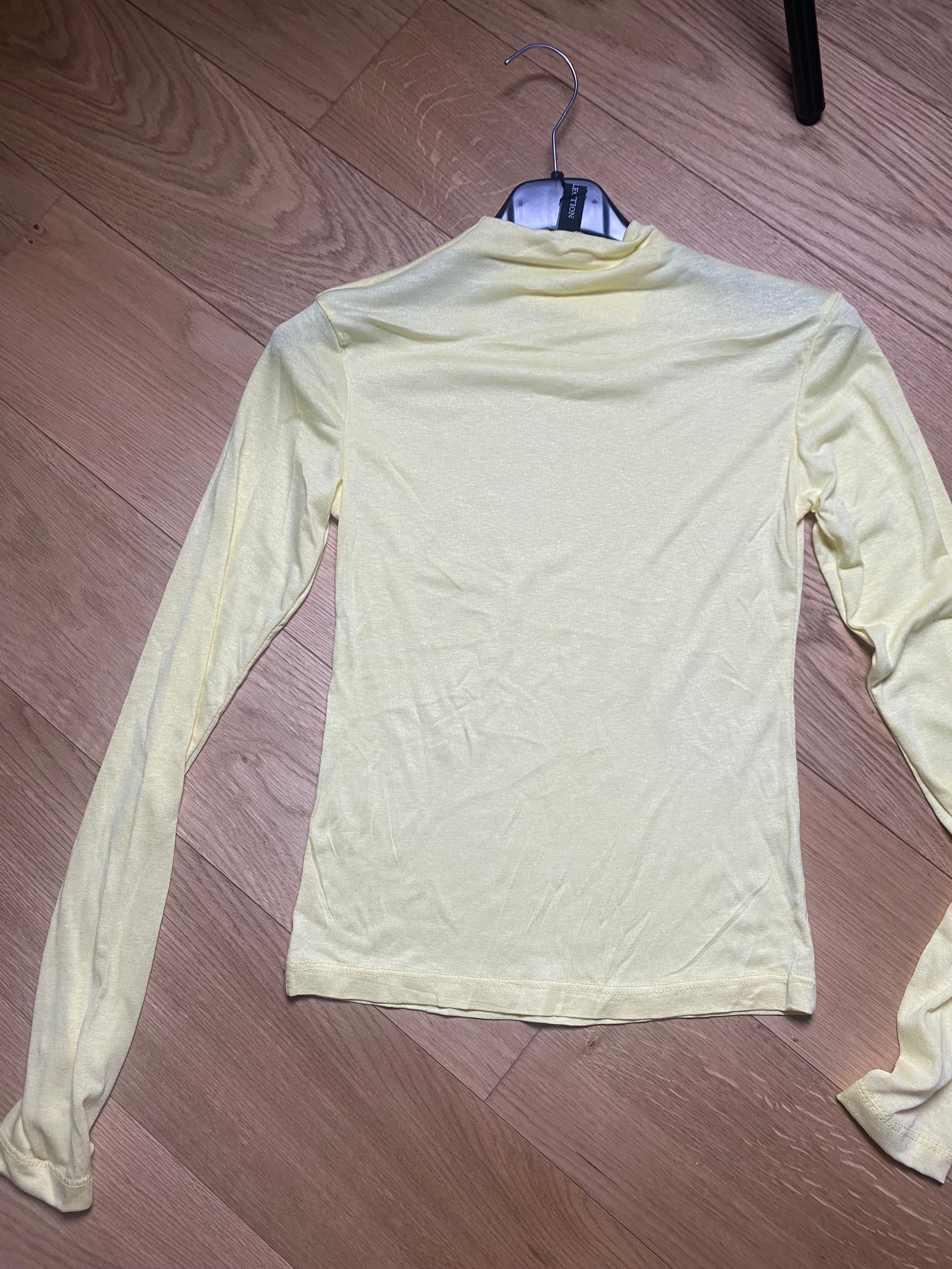 Maglia semi trasparente mezzo collo